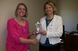 Kalix CEO Gives Award to Kathryn Lenertz