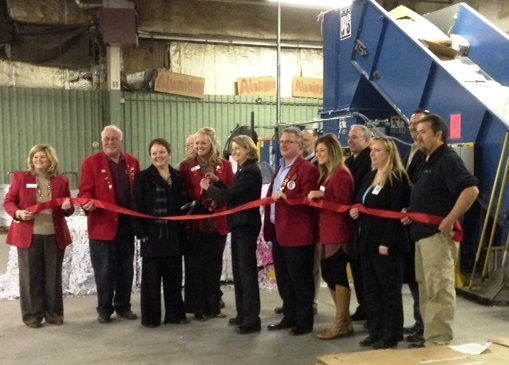 Borgi Beeler, Kalix CEO, along with MADC members and Kalix staff shown cutting ribbon for new Kalix Recycling Center Baler
