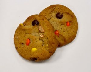 Two Reese's pieces cookies on a white background