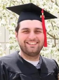 Pictured: Lane Banister in graduation gown and cap.